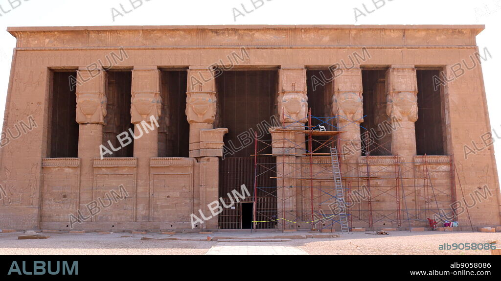 The facade of Temple of Hathor, Dendera, Egypt. It is one of the best-preserved temple complexes in Egypt. The Hathor temple (Temple of Tentyra) has been modified on the same site starting as far back as the Middle Kingdom, and continuing right up until the time of the Roman emperor Trajan. The existing structure was built no later than the late Ptolemaic period. The temple, dedicated to Hathor, is one of the best preserved temples in all Egypt.