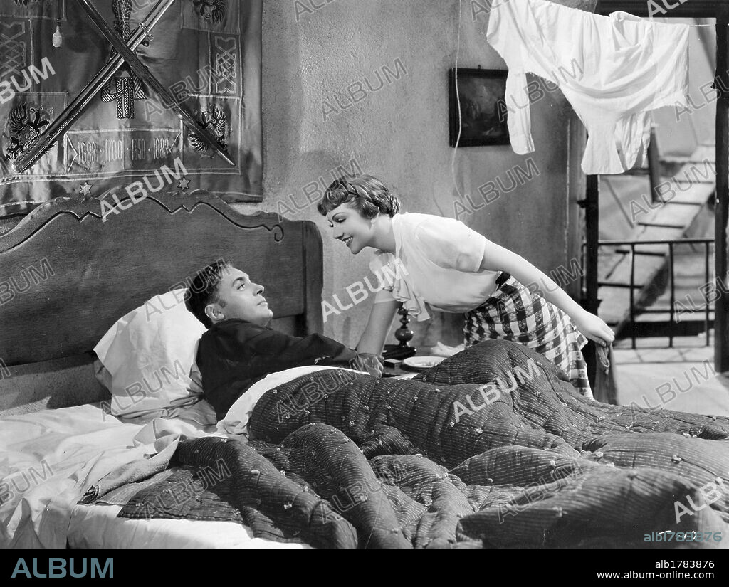 CHARLES BOYER and CLAUDETTE COLBERT in TOVARICH, 1937, directed by ANATOLE LITVAK. Copyright WARNER BROTHERS.