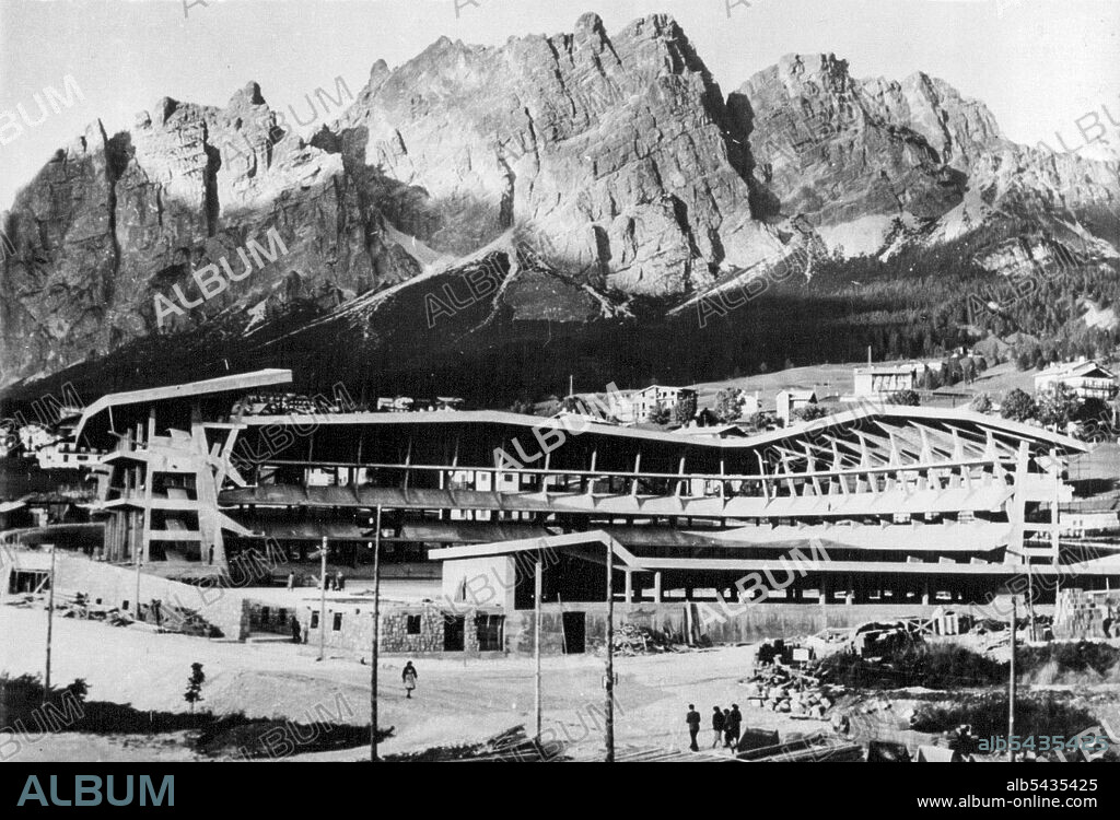 For The Winter Olympiad of 1956 -- The impressive setting at Cortina d'Ampezzo, Northern Italy, which will be the scene of the Winter Sports section of the Olympic Games in 1956. The fine rink with its covered stands is seen in foreground. January 03, 1955. (Photo by Sport & General Press Agency, Limited).