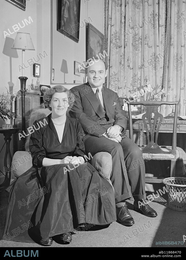 ENGAGED COUPLE. The engagement of GEORGE ANTHONY GEOFFREY , only surviving son of the late Hon . Geoffrey and Mrs Howard , of Castle Howard , York, and CECILIA BLANCHE GENEVIEVE , daughter of the 8th Duke of Grafton and the Dowager Duchess of Grafton , of 18 , Princess Gate , S.W. is announced today . Lady Cecelia Blanche Genevieve Fitzroy , who was born in 1933 , and drove an ambulance in Edinburgh for two years during the war . Then she became secretary to a research chemist engaged on '' hush-hush'' experiments . She later joined the W.A.A.F. and specialised in radiolocation . PICTURE SHOWS:- The engaged couple , pictures at Lady Fitzroy's home in Princess Gate , London . 19 January 1949.