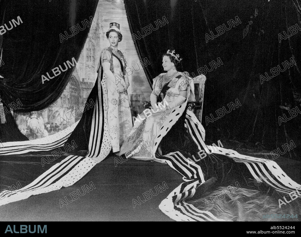 In The Throne Room Of Buckingham Palace -- Queen Elizabeth the Queen Mother and Princess Margaret wearing their coronation robes are seen in the Throne Room of Buckingham Palace, London, on Coronation day June 2nd, 1953. The Queen Mother's gown is of creamy white satin, short sleeved with a U-shaped inset of gold lame on the bodice. It is embroidered in a delicate design, worked horizontally, of trailing ostrich feathers, the stems of glittering diamante. Princess Margaret's dress was the only all-white one worn by the Royal party in the Abbey. Sleeves and bodice are embroidered with silver, diamante and pearls, and sewn with medallions of broderie anglaise in silver and pearls. July 9, 1953.