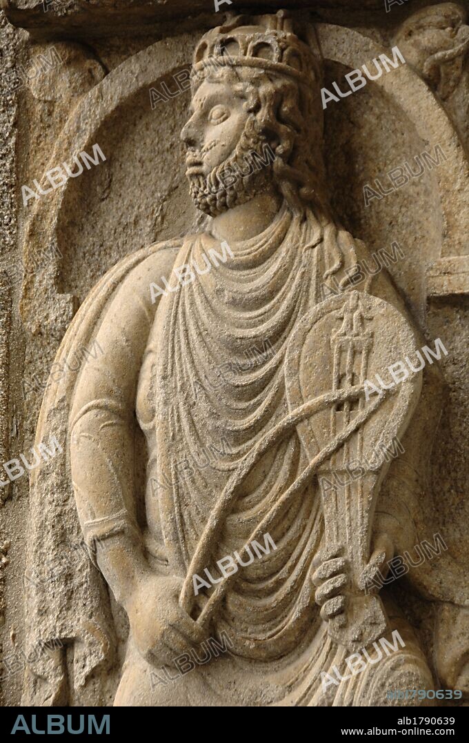 Santiago de Compostela, La Coruna province, Galicia, Spain. Cathedral. Left buttress of the Platerias facade. Romanesque relief of King David playing a rebec. 11th century.