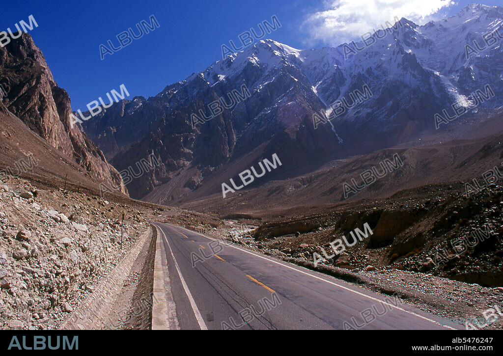 The Pamir Mountains are a mountain range in Central Asia formed by the junction of the Himalayas, Tian Shan, Karakoram, Kunlun and Hindu Kush mountain ranges. They are among the world's highest mountains and since Victorian times they have been known as the 'Roof of the World', a probable translation from the Persian. The Zhongba Gonglu or Karakoram Highway is an engineering marvel that was opened in 1986 and remains the highest paved road in the world. It connects China and Pakistan across the Karakoram mountain range, through the Kunjerab Pass, at an altitude of 4,693 metres (15,397 ft).