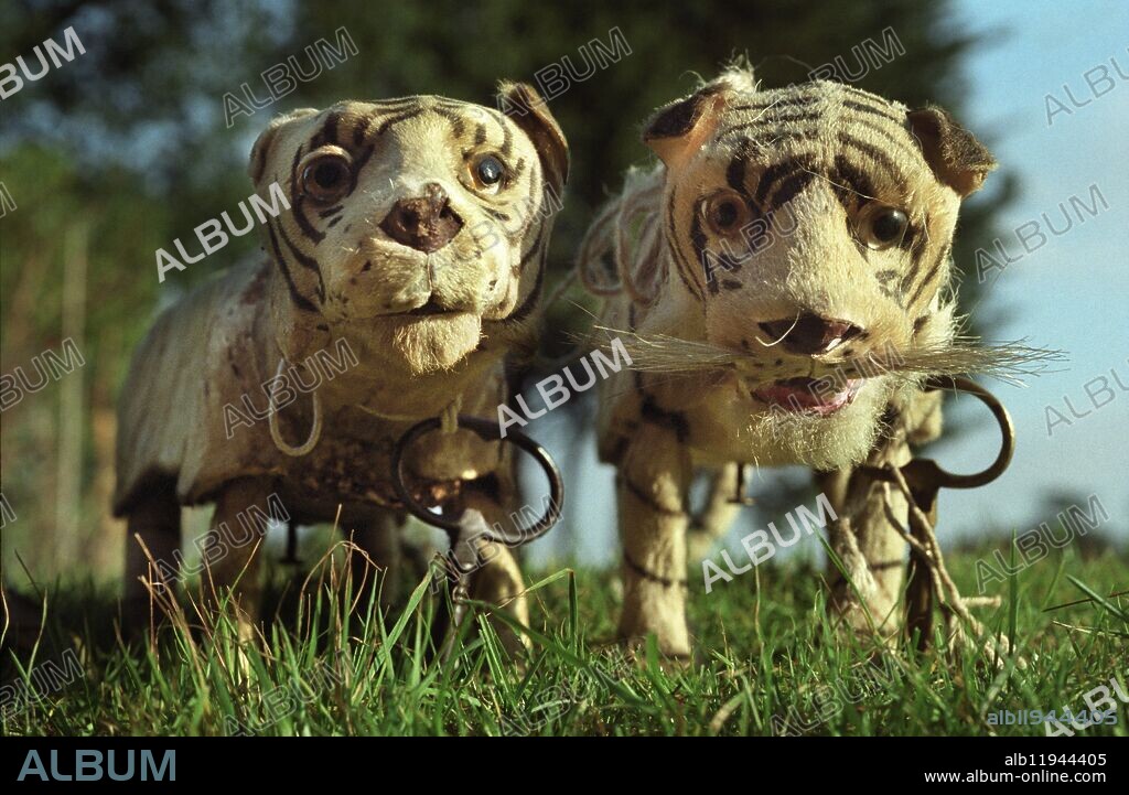Picture by Roger Bamber: Clockwork toy tigers for sale in auction of Toys and Dolls by Sotheby's, Billingshurst, West Sussex, England, UK. magical; mysterious; storybook; dream; imagination; fantasy world; deep in the undergrowth; muzzlw; snout; nose; whiskers; stripes; striped;.
