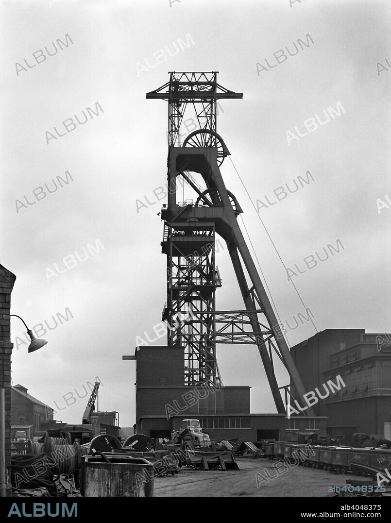 The headgear at Clipstone Colliery, Nottinghamshire, 1963. The original shafts of Clipstone Colliery in Mansfield were sunk in 1922 to give access to the top hard seam. In the 1950s the shafts were deepened to their current 920m depth to provide access to other seams. After its closure by British Coal in 1993, the colliery was reopened under the control of RJB Mining in April 1994 until it again ceased operations in 2003 after producing a further four million tonnes of coal.