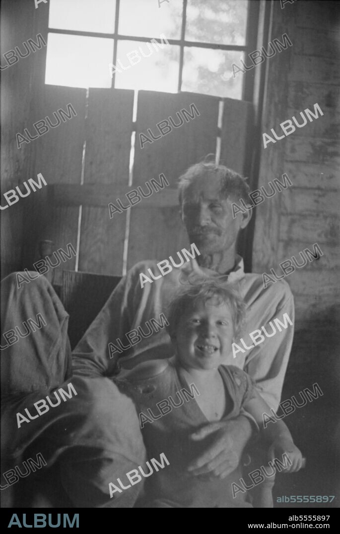 WALKER EVANS. Bud and William Fields, Hale County, Alabama. [Sharecropper and his son].