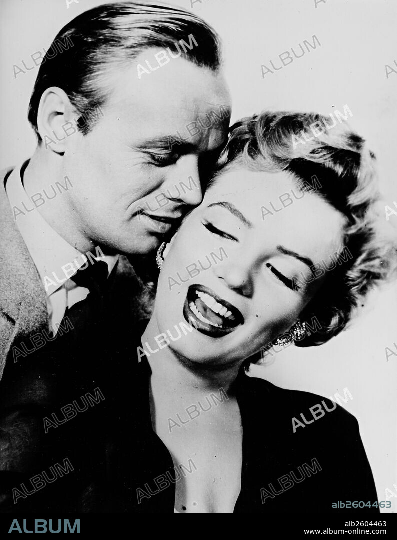 NORMA JEAN BAKER y RICHARD WIDMARK. MARILYN MONROE y RICHARD WIDMARK en NIEBLA EN EL ALMA, 1952 (DON'T BOTHER TO KNOCK), dirigida por ROY WARD BAKER. Copyright 20TH CENTURY FOX.
