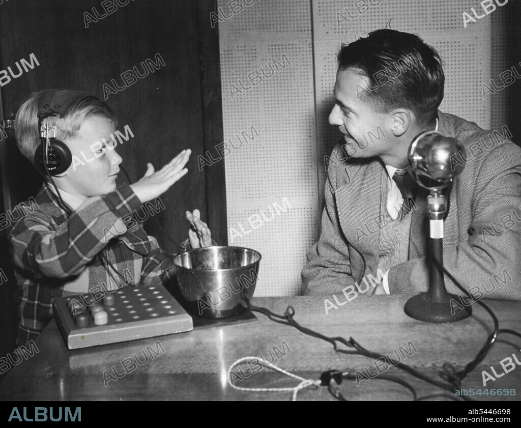 "As big as that" John Hynd responds to the nursery rhyme technique used during a test in the laboratory. August 3, 1953. (Photo by David R. Jones).