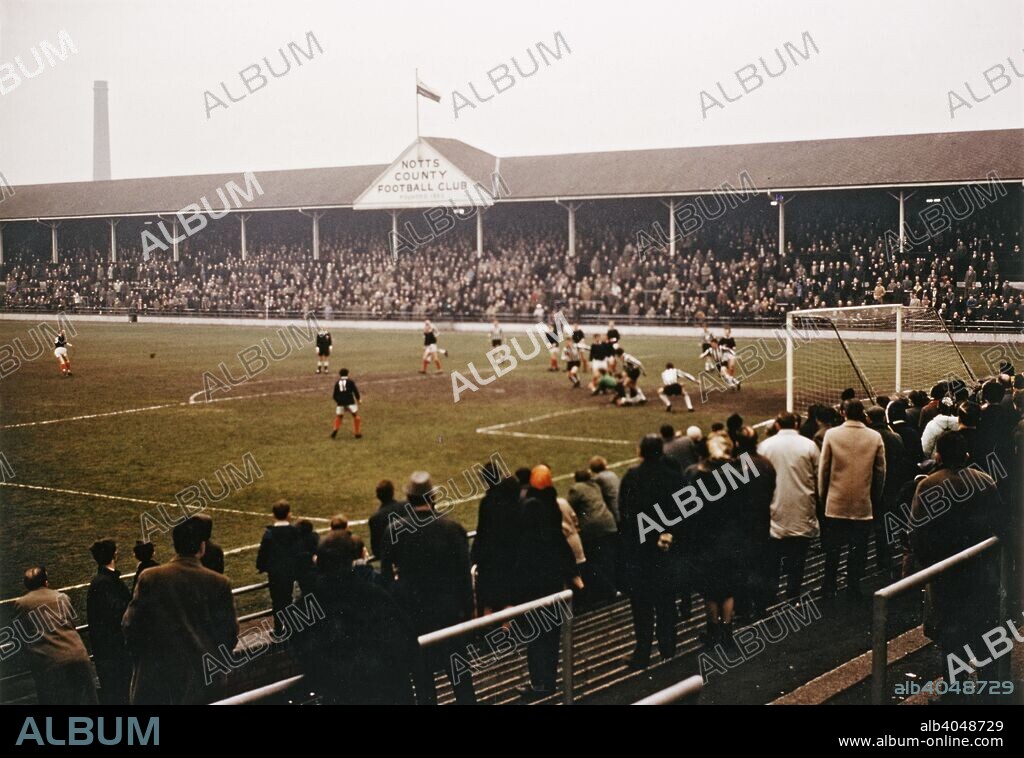 Notts County football match, Meadow Lane, Nottingham, Nottinghamshire, 1968. Notts County was formed in 1862 and was a founder member of the English Football League in 1888. The Meadow Lane stadium, the club's home since 1910, was completely rebuilt in the 1990s at a cost of £8 million and has a capacity of 20,300, all seated.
