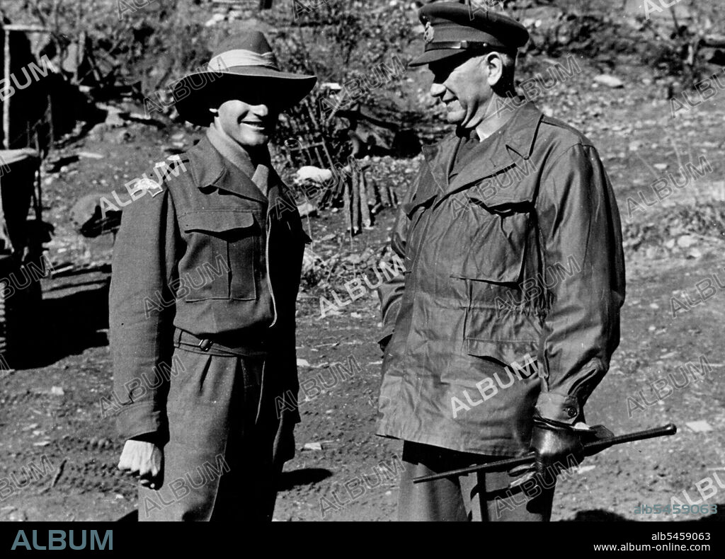 Public Relations Section. HQ BCOF. Japan -- Lt.-Gen. Bridgoford visited the Australians under his command during his tour of Korea. Here he is shown chatting with Lt.-Col. Frank Hassett, DSO, OBE, brilliant young Australian commander who was a lieutenant-colonel at 23, and recently gained his DSO for his handling of 3 Bn in the Korean fighting. December 7, 1951.