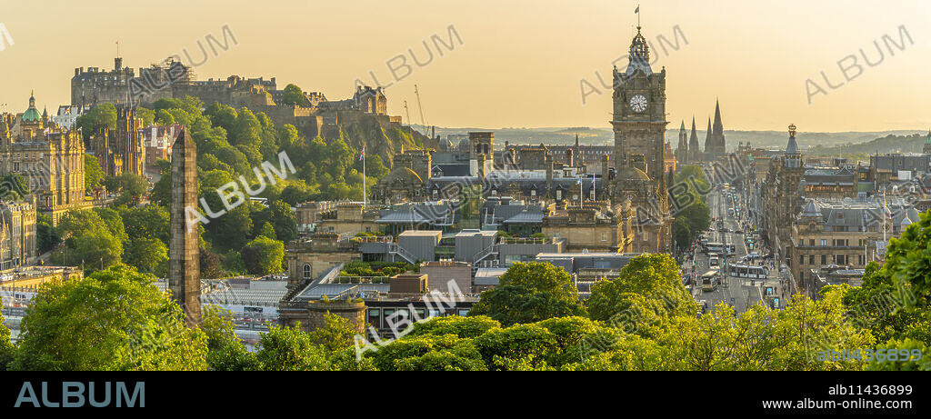 View of Edinburgh Castle, Balmoral Hotel and Princes Street from Calton Hill at golden hour, Edinburgh, Lothian, Scotland, United Kingdom, Europe.