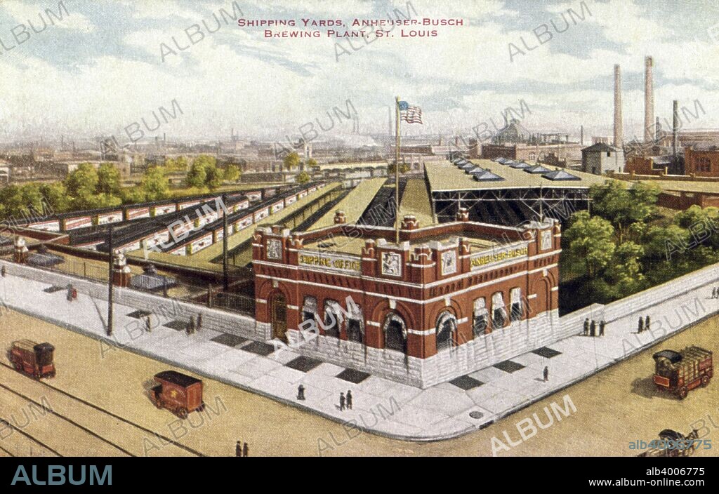 Shipping yards, Anheuser-Busch brewing plant, St, Louis, Missouri, USA, 1910. Vintage postcard. Rail cars line the tracks and a red brick building is in the foreground. Trucks drive along the street. Anheuser-Busch is best known for brewing Budweiser beer.