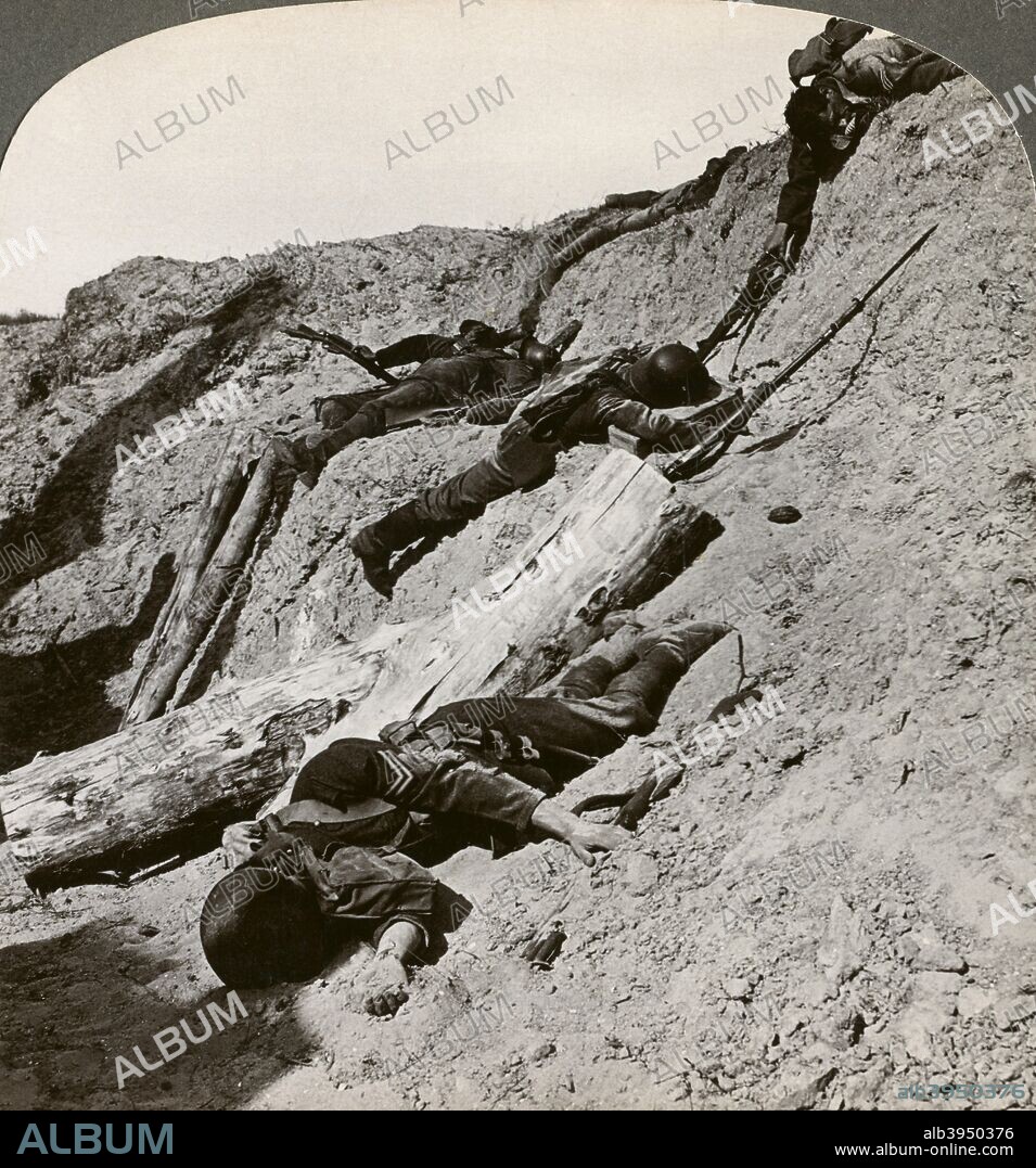 British and German dead near the Hohenzollern Redoubt, Lens, France, World War I, 1914-1918. The Hohenzollern Redoubt was a fortified position on the German lines that was the site of fierce fighting in September-October 1915 during the Battle of Loos. The British 46th (North Midland) Division suffered 3763 casualties there on 13th October 1915. Stereoscopic card detail.