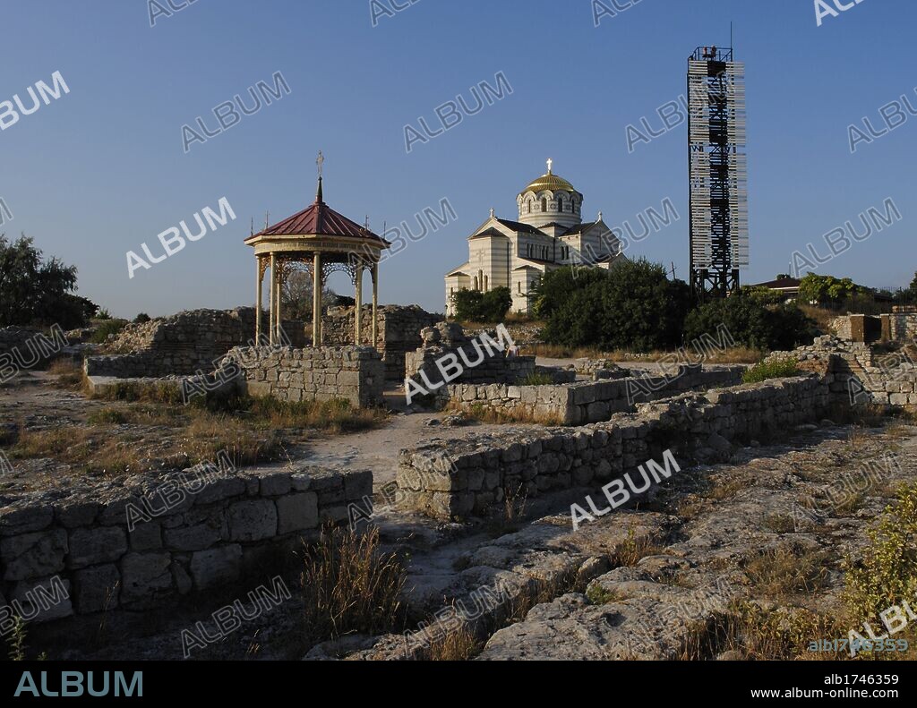 Ukraine. Ruins of greek colony Chersonesus Taurica. 6th century BC. At background, Neo-Byzantine Russian Orthodox Church reconstructed at 21th century by E. Osadchiy. First, the supposed spot of christening of Prince Vladimir the Great. Sevastopol.