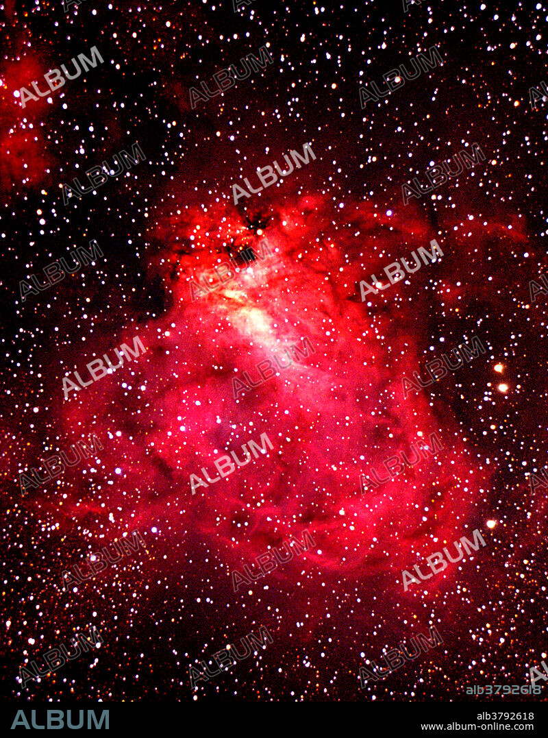 The Swan Nebula in Sagittarius is sometimes called the Omega or Check mark. This object consists mostly of hydrogen gas that glows from the radiation of nearby stars. Taken with a Meade 16 LX200 telescope.