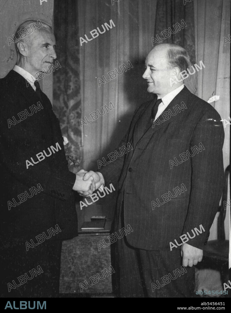 New Polish Cabinet Sworn In -- The President Mr. Raczkiewicz (left) congratulates the Prime Minister Mr. Stanislaw Mikolajczyk, after the ***** in ceremony of the new polish cabinet.The new polish Cabinet formed ***** Premiership of Mr. Stanislaw Mikolajczyk, was sworn in today, July 4, at ***** Government house London. the ***** of thirteen is composed of three ***** of the peasant party, three of the party, two of the national Labour two of the nationalist party and Non-party members. September 06, 1943. (Photo by Associated Press Photo).