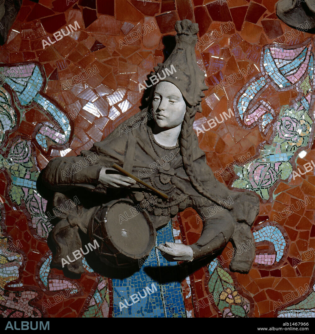 Modernism.  Muse playing the drum.  The upper body  was culpted by Eusebi Arnau (1863-1933) and the mosaic work of their lower bodies was created by Lluis Bru (1868-1952). Chamber of the concert hall. Back of the stage. Palace of Catalan Music (1908). Barcelona. Catalonia. Spain.