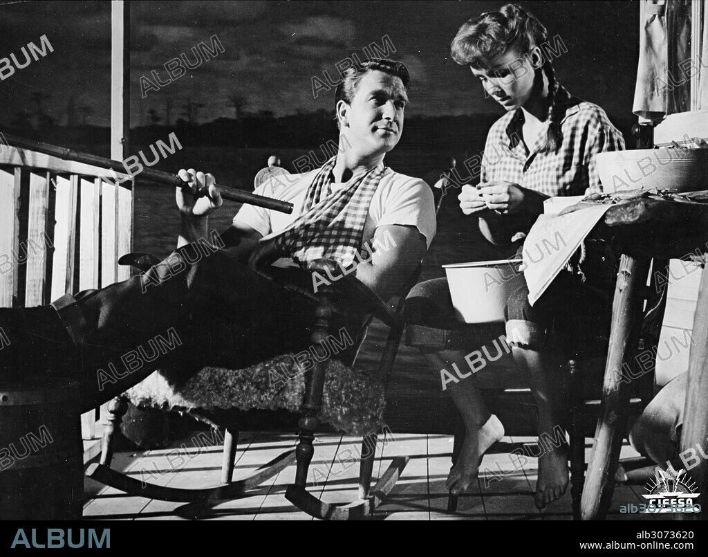 DEBBIE REYNOLDS and LESLIE NIELSEN in TAMMY AND THE BACHELOR, 1957, directed by JOSEPH PEVNEY. Copyright UNIVERSAL INTERNATIONAL PICTURES.