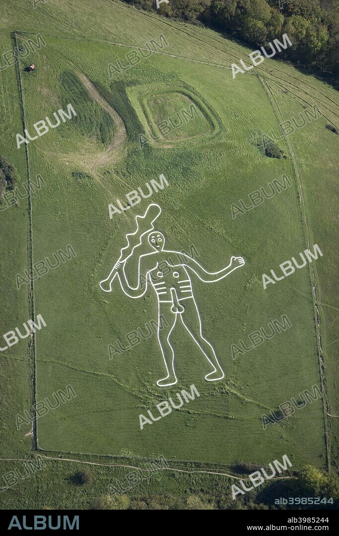 Cerne Abbas Giant, Dorset, 2008. Aerial view. The giant's origin is uncertain, although one theory is that he was cut to represent England's Hercules, as a parody of Oliver Cromwell. The rectangular earthwork above the giant is known as the Trendle, an Iron Age enclosure possibly for a farmstead. In the 19th century the earthwork was traditionally used as the setting for a Maypole. The site is in the care of the National Trust.