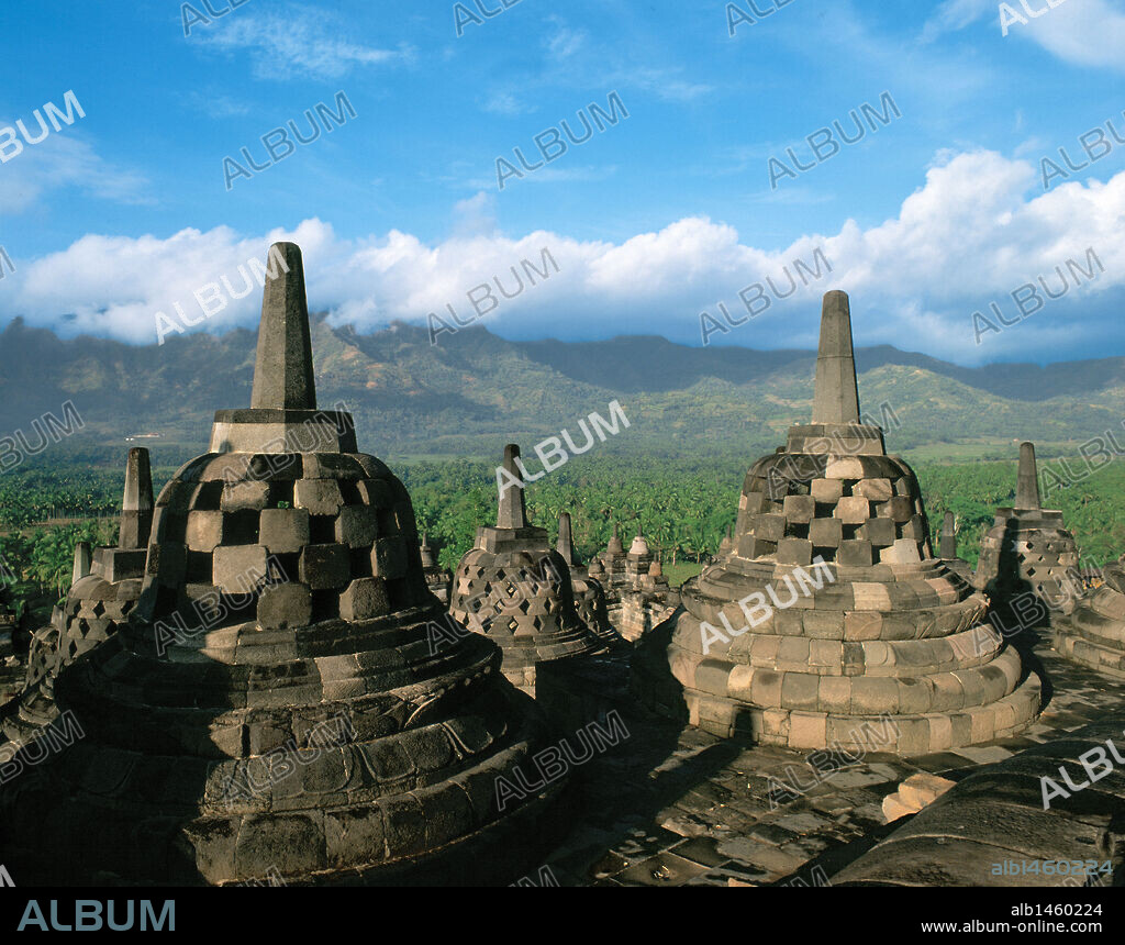 Indonesia. Central Java. Magelang. Borobudur.  9th-century Mahayana Buddhist monument. Stupas overlooking a mountain.