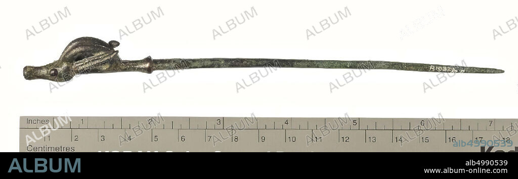 A bronze pin rising from above into a gazelle head, ornament, metal, bronze, L 18 cm, Iran.