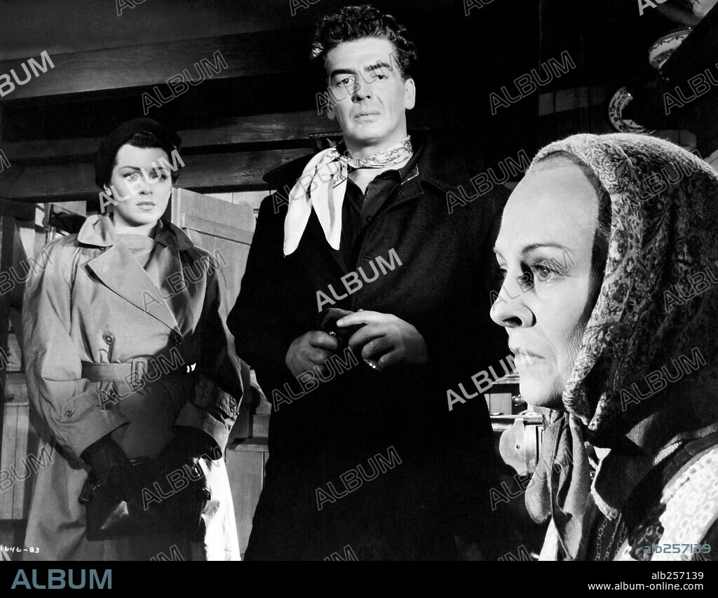 LANA TURNER y VICTOR MATURE en BRUMAS DE TRAICIÓN, 1954 (BETRAYED), dirigida por GOTTFRIED REINHARDT. Copyright M.G.M.