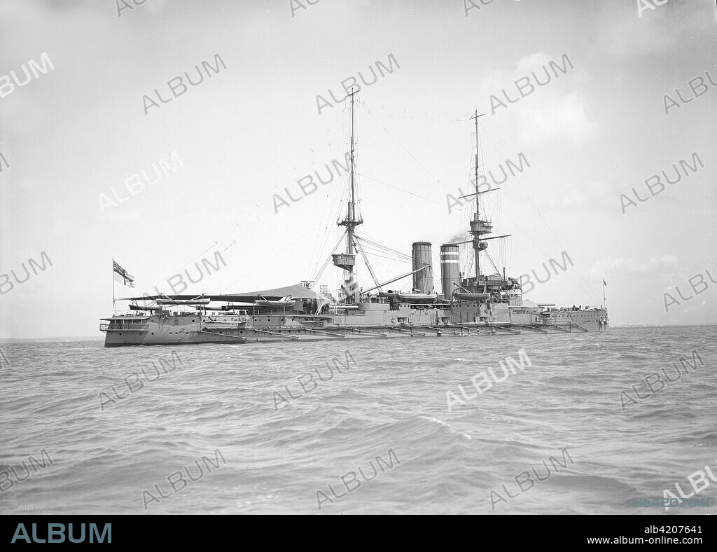 'HMS Hindustan', 1911. HMS Hindustan was a King Edward VII-class pre-dreadnought battleship of the Royal Navy. Commissioned in mid 1905, she served with firstly the Atlantic Fleet and then the Channel Fleet. During WW1 'Hindustan' served in the Grand Fleet until April 1916. During sweeps by the fleet, she and her sister ships often steamed at the heads of divisions of the far more valuable dreadnoughts, where they could protect the dreadnoughts by watching for mines or by being the first to strike them.
