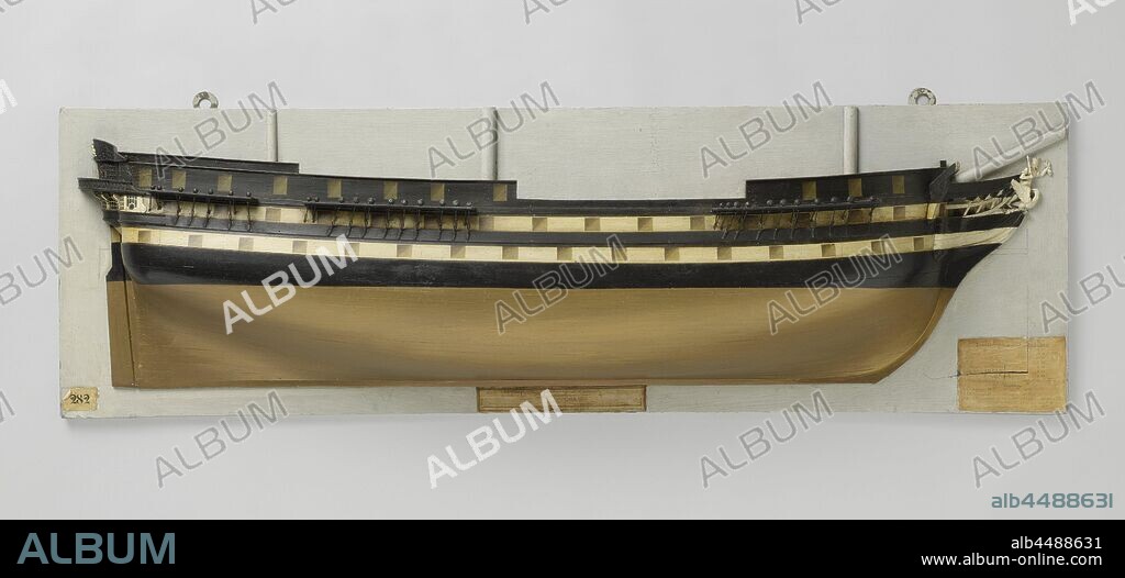 Half Model or a 74-Gun Ship of the Line, Fully planked and polychromed mold model (starboard) of a three-mast. Forty-six gun ports spread over three decks. The figurehead is a crowned man with a scepter in the right hand and a bundle of flames in the raised left hand, standing on a bird. A lion's head on the crane beam. Round stern with a two-storey fence, elaborately decorated, with a semicircular gallery at the rear. The western corridor on the top floor, which runs around the gallery, is supported by decorated knees. The bulwark above the fence is damaged. Below the gallery the hemp hole: straight rudder with square rudder king. The sheer runs slightly on both ends, two mountain wood and one deer wood. The underwater ship is fairly flat, but sharply cut away behind. Scale 1:50 (scale on model)., Jupiter (ship), Kortenaer (ship), anonymous, Netherlands, c. 1825 - c. 1833, wood (plant material), h 44 cm × w 135.6 cm × d 17.1 cm.