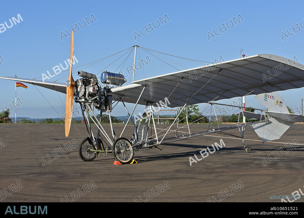 The Santos-Dumont Demoiselle ( Damselfly ) was an early aircraft built in France by Brazilian aviation pioneer Alberto Santos-Dumont. It was a light-weight monoplane with a wire-braced wing mounted atop an open-framework fuselage built around a reinforced bamboo boom. The pilot's seat was below the wing, and between the main wheels of the undercarriage. The rear end of the boom carried a tailwheel and a conventional empennage. As originally designed (as the Santos-Dumont No. 19) Santos-Dumont used a liquid-cooled Dutheil & Chalmers flat-twin engine rated at 15 kW (20 hp) mounted on the leading edge of the wing. Later, the inventor repositioned the engine to a lower location, placing it in front of the pilot. The Demoiselle was controlled in flight by a tail unit, pivoting on a form of universal joint that functioned both as elevator and rudder, which the pilot operated with a steering wheel.
