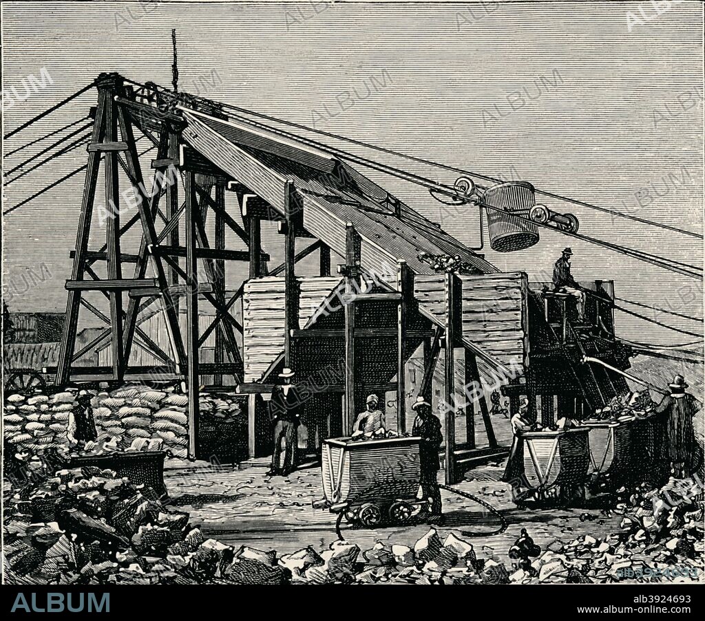 Kimbereley Diamond Mine: apparatus for raising the diamantiferous earth. In 1887 and 1888 Cecil Rhodes amalgamated the diamond mines around Kimberley, which included De Beers, into Consolidated Mines. From The Life and Times of The Right Honourable The Marquis of Salisbury, K.G., published by J. S. Virtue & Co. Ltd., 1896.