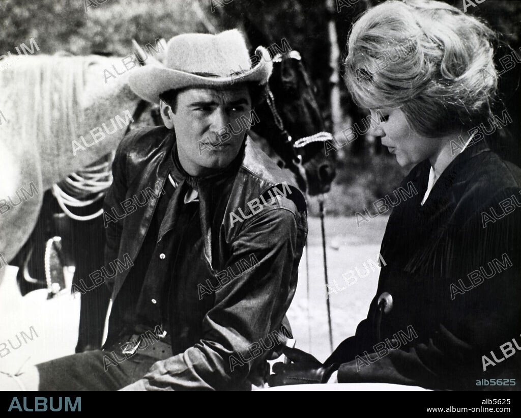EDMUND PURDOM in SHOOT TO KILL, 1965 (LOS CUATREROS), directed by RAMON TORRADO. Copyright COOPERATIVA CINEMATOGRAFICA.
