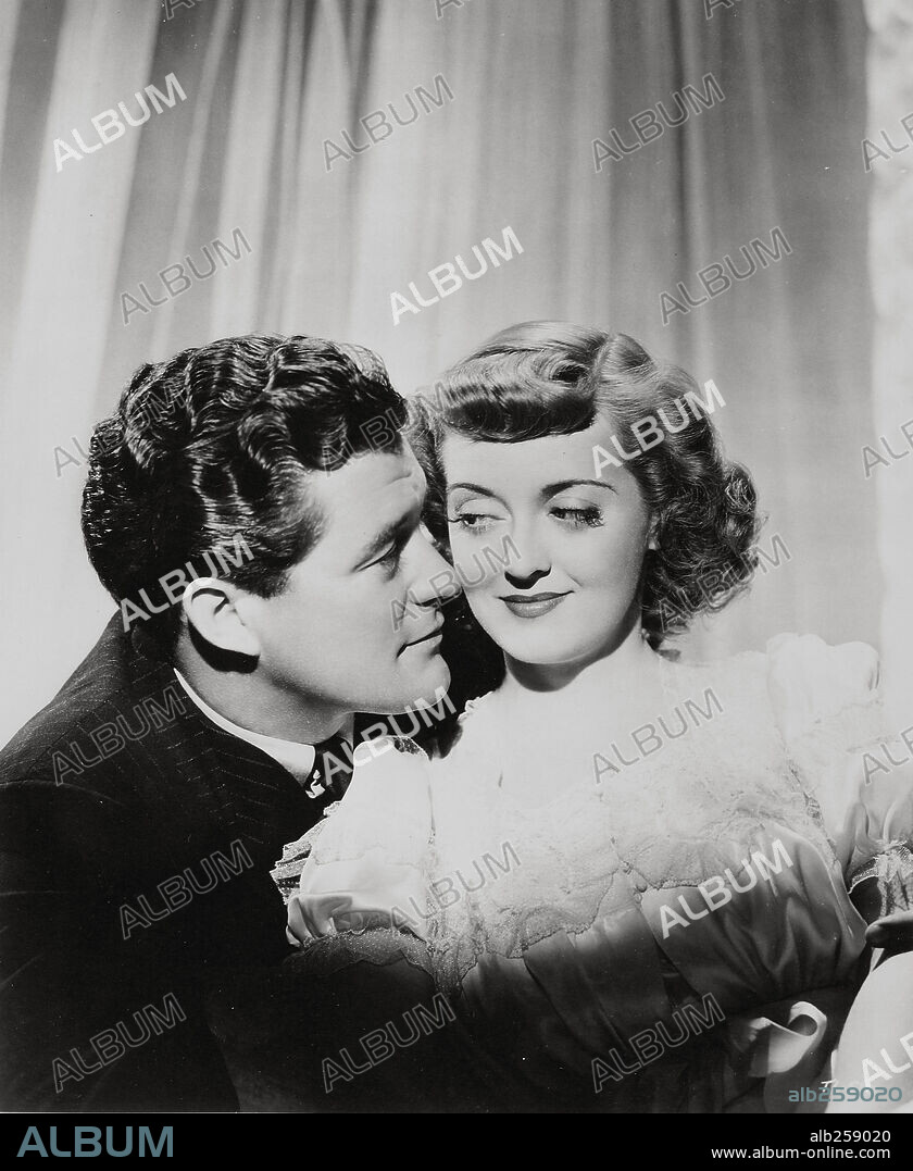 BETTE DAVIS and DENNIS MORGAN in IN THIS OUR LIFE, 1942, directed by JOHN HUSTON. Copyright WARNER BROTHERS.