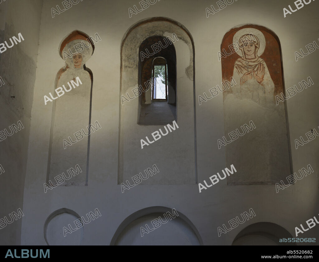 Romanesque frescoes depicting two saints. Transept of the Cristo de la Luz Shrine, a former mosque, built at the end of the 10th century and converted into a Christian church in the 12th century. Toledo, Castile-La Mancha, Spain.