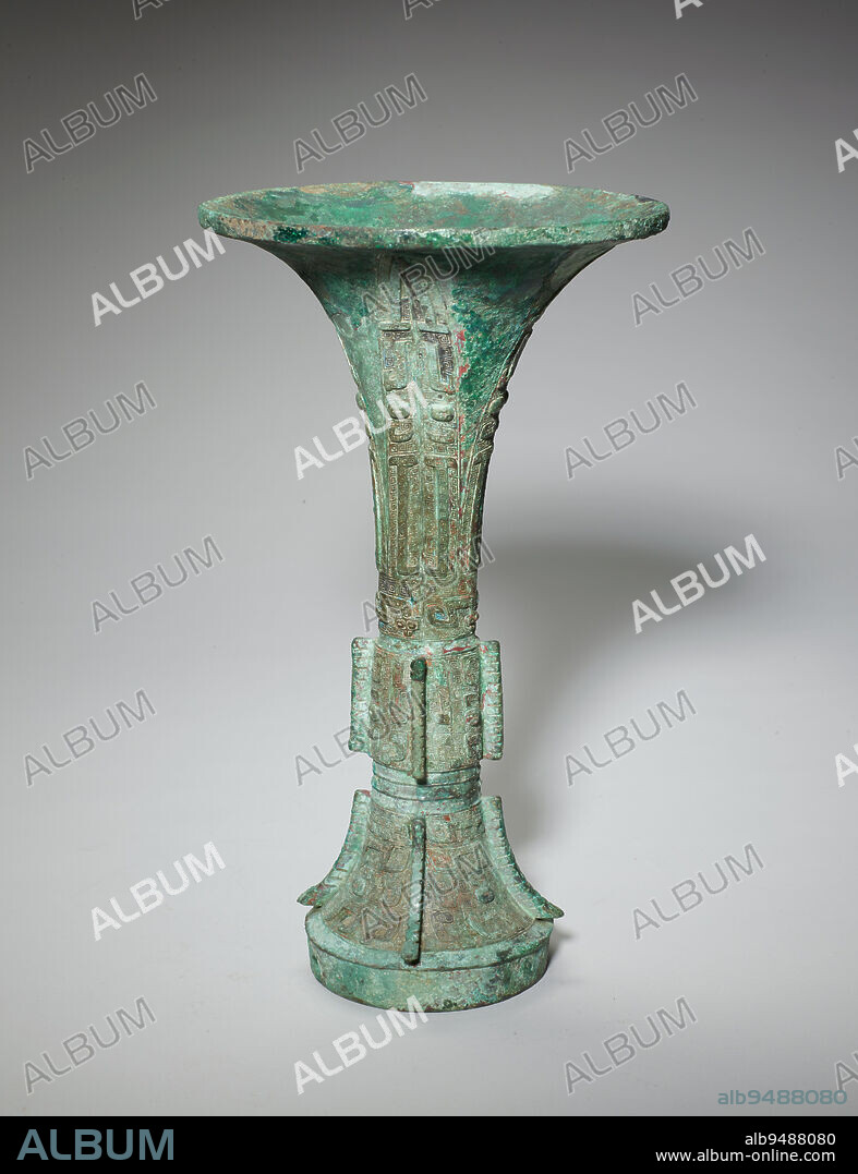 Gu wine vessel, 12th-11th century BCE, 11 3/4 × 6 5/8 in., 3.3 lb. (29.85 × 16.83 cm, 1.5 kg), Bronze, China, 12th-11th century BCE, The gu is a tall wine beaker with an unusually taut and graceful silhouetteits trumpet-shaped top tapers to a slim center section before widening again to a slightly flared base. Archaeological evidence reveals that bronze gu first appeared during the Erligang period (c. 15001300 BCE) of the Shang dynasty. The gu enjoyed its greatest popularity during the Shang dynasty (c. 16001046 BCE), but became less popular in the early Western Zhou (c. 1046977 BCE), before gradually disappearing during the Eastern Zhou dynasty (770256 BCE). The gradual decline of the wine vessel may have something to do with the Zhou kings deprecation of alcohol consumptionhe believed that overindulgence in alcohol resulted in the collapse of Shang. This gu is decorated with variations of the taotie (composite animal) mask. The background pattern of tight spirals, found all over the vessel, is called leiwen and is a hallmark of Shang bronze casting.