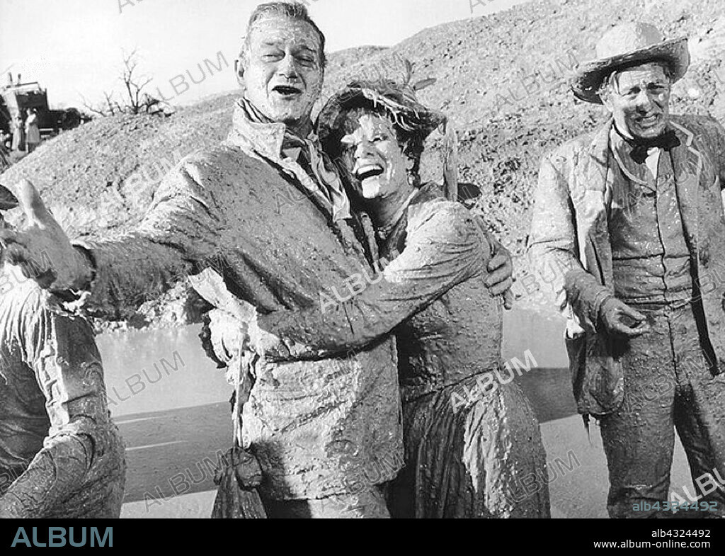 JOHN WAYNE and MAUREEN O'HARA in MCLINTOCK!, 1963, directed by ANDREW V. MCLAGLEN. Copyright UNITED ARTISTS.