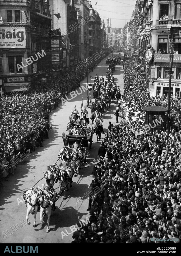 Royal Silver Wedding -- King George VI and Queen Elizabeth, riding in the 1902 State Landau, drawn by six Windsor greys with two outriders, arrive at Ludgate Circus, from Fleet Street, enroute to attend their Silver Wedding thanksgiving service at St. Paul's London, April 26. Princess Elizabeth and the Duke of Edinburgh follow them in a semi-state Landau drawn by four bays.Both coaches are accompanied by household Cavalry. Princess Margaret sits opposite King and Queen in the their coach. May 11, 1948. (Photo by Associated Press Photo).