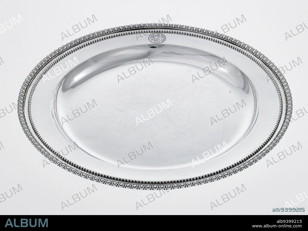 Serving plate from the Williams-Wynn service, one of a pair, 1773, Robert Adam; Silversmith: John Carter, Scottish / British, Scottish, 1728-1792, 15/16 x 13 1/16 x 13 1/16 in. (2.38 x 33.18 x 33.18 cm), Silver, 18th century, In his monumental publication Works in Architecture, Robert Adam illustrated his work at 20 St. James's Square in London, the townhouse of Sir Watkins Williams-Wynn. Adam designed every aspect of its highly influential interior, including all furnishings, to create a total work of art inspired by archeological motifs. These plates belong to the elaborate dinner service Adam designed for 20 St. James Square. Whether serving meats during the second course at dinner, or on display along the sideboard, these plates were made to reflect the spare elegance of the interior.