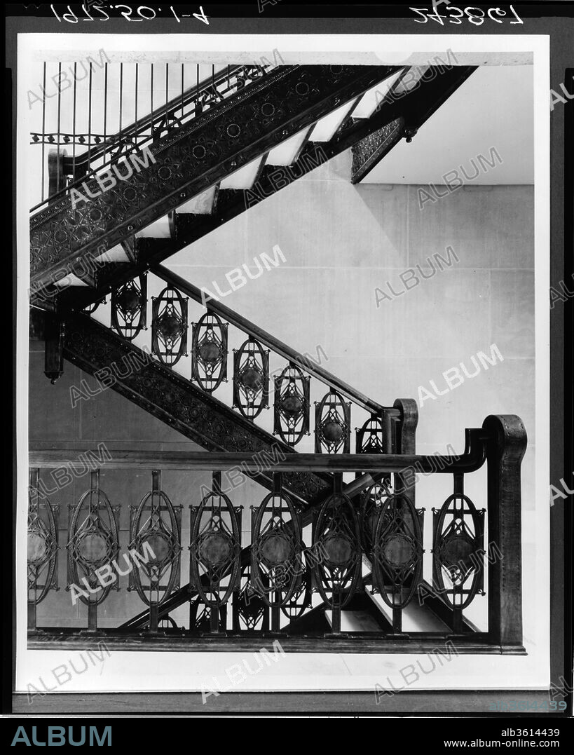 Staircase from Chicago Stock Exchange Building, Chicago. Culture: American. Dimensions: 144 x 92 x 156 in. (365.8 x 233.7 x 396.2 cm). Maker: Louis Henry Sullivan (American, Boston, Massachusetts 1856-1924 Chicago, Illinois); Dankmar Adler (American, 1844-1900). Date: 1893.
During the building boom following the famous fire of 1871, the Chicago-school architects, led by Sullivan, invented a new building type: the skyscraper. One of the masterpieces of the form was the Chicago Stock Exchange Building, completed in 1894. The staircases installed here were removed from the building when it was demolished in 1972. The copper-plated ironwork exemplifies Sullivan's mature ornamental style--a combination of two-dimensional geometric shapes and naturalistic plantlike forms. Sullivan used similar motifs throughout the building, executing them in a variety of media, from stenciled canvas to molded plaster and terracotta.