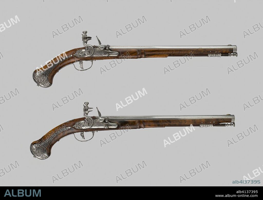 Pair of Flintlock Holster Pistols. Lazzarino Cominazzo; Italian, Brescia, 17th century. Date: 1650-1680. Dimensions: L. 55 cm (21 5/8 in.)
Barrel L. 37.5 cm (14 3/4 in.)
Caliber .54
Wt. 1 lb. 14 oz. each. Ivy root, brass, and steel. Origin: Italy.