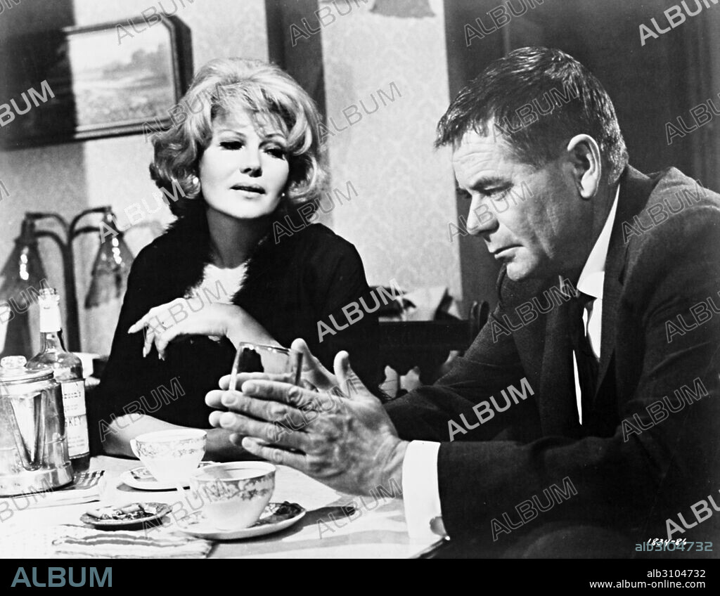 GLENN FORD and RITA HAYWORTH in THE MONEY TRAP, 1965, directed by BURT KENNEDY. Copyright M.G.M.