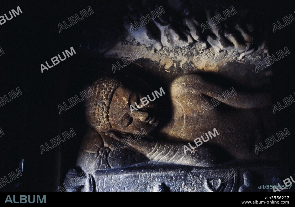 Statue of reclining Buddha in Ajanta caves no. 26, Aurangabad, Maharashtra, India.