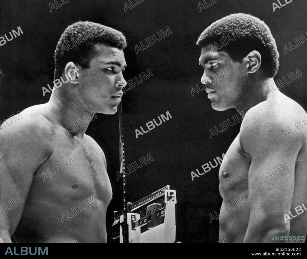 Houston, Texas:   February, 6, 1967. Heavyweight champion Cassius Clay focuses his whammy eye on challenger Ernie Terrell during the weigh in for tonight's title fight.