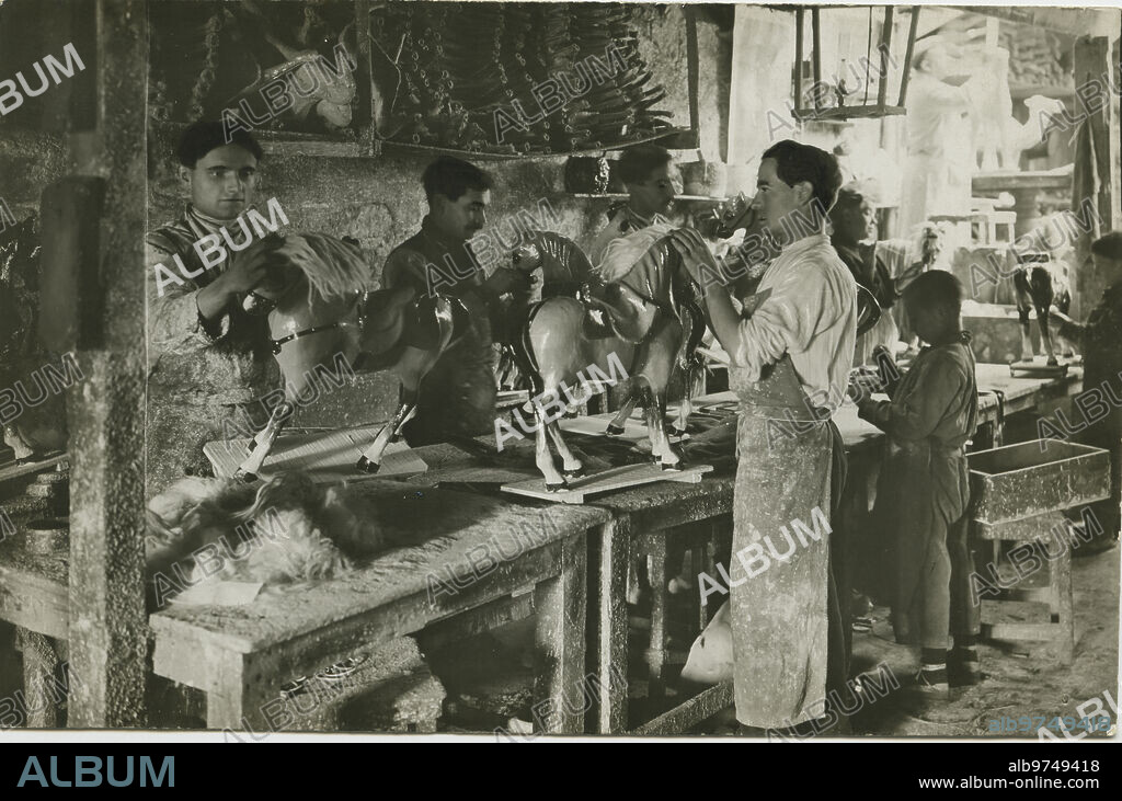 Barcelona, 1914. Toy factory. The placement of manes is the last phase of the manufacture of the horses.
