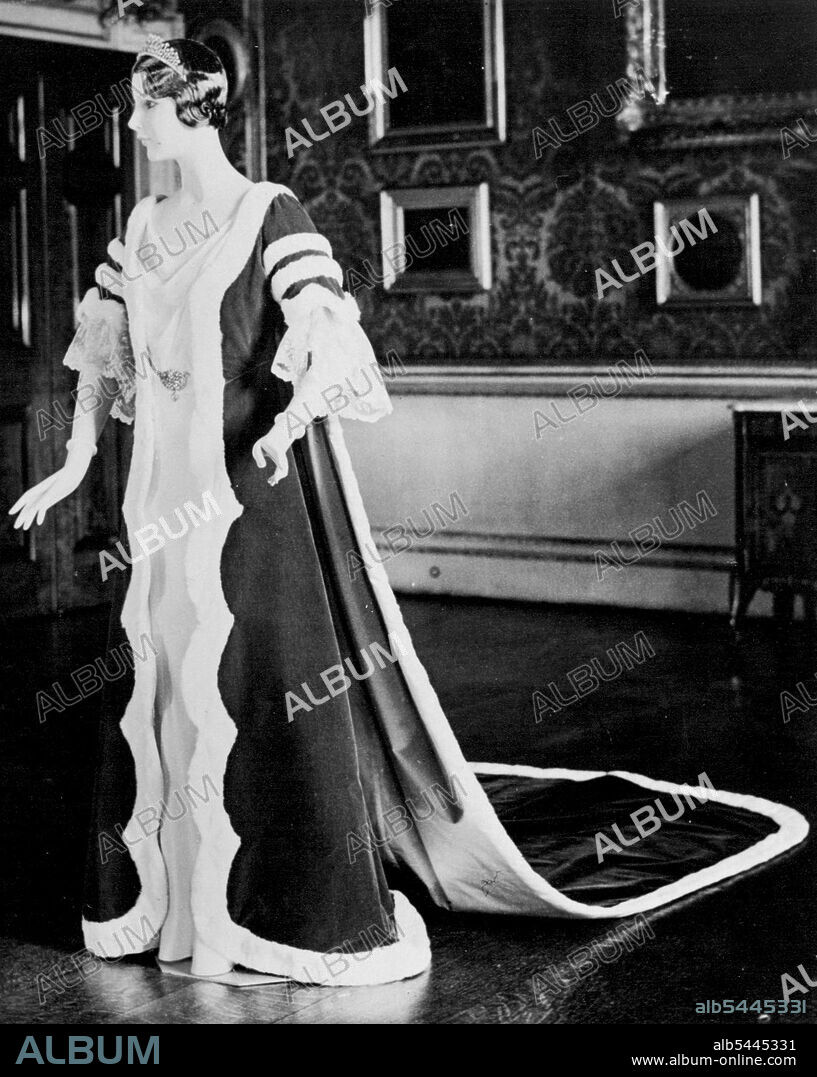 Peeress's Coronation Robe Our photographs shows a Coronations robe which will be worn by a Viscountess. The Kirtle and Train are of Crimson velvet with bordered edges of miniver (ermine). It was photographed at Norfolk House today, November 10. The hand-made lace trimming the sleeves can be worn at option. November 30, 1936.