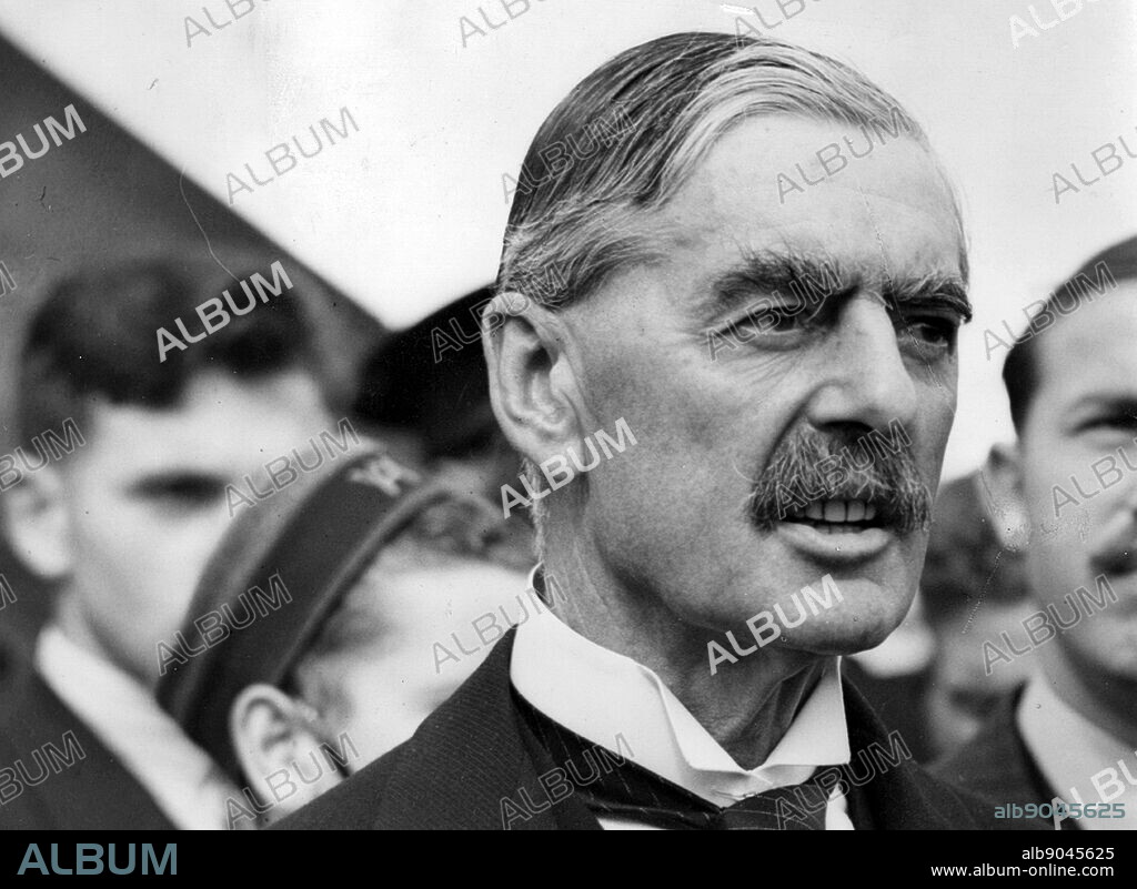 British Prime minister Neville Chamberlain returns to England in 1938 from talks with Hitler at Munich.
