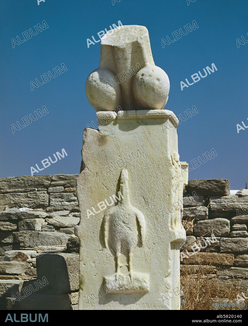 Dionysos Sanctuary, Delos, monumental phallus with a relief of the phallus-bird, a symbol of the God, carried in procession or drawn on a chariot during Dionysian rites. Inscription says the monuments were donated by Karystios, son of Asbelos. Around 300 BCE.