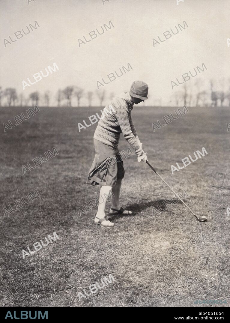 A lady golfer playing at Falsterbo Colf Club, Sweden. Established in 1909, Falsterbo is the only true links course in Sweden.