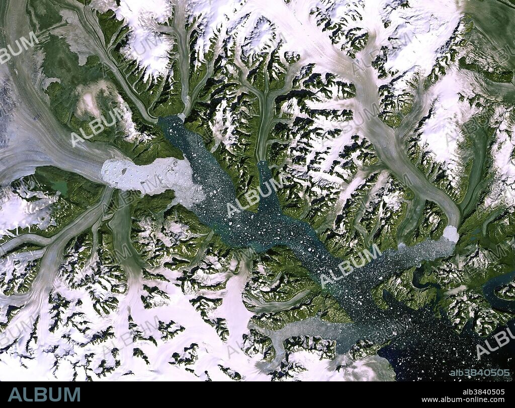 The Kangerdlugssuaq glacier and its ice stream, in an image from the Landsat-7 satellite. It is the largest outlet glacier on Greenland's east coast, discharging ice into the surrounding oceans. A recent study based on satellite observations revealed that over the past 20 years the ice melting in Greenland and Antarctica has contributed about 11 mm to the global sea-level rise. This image clearly shows the glacier's calving front, where ice breaks away. Over the years, satellite images have shown that this front has retreated, which indicates that the glacier is getting smaller over time.