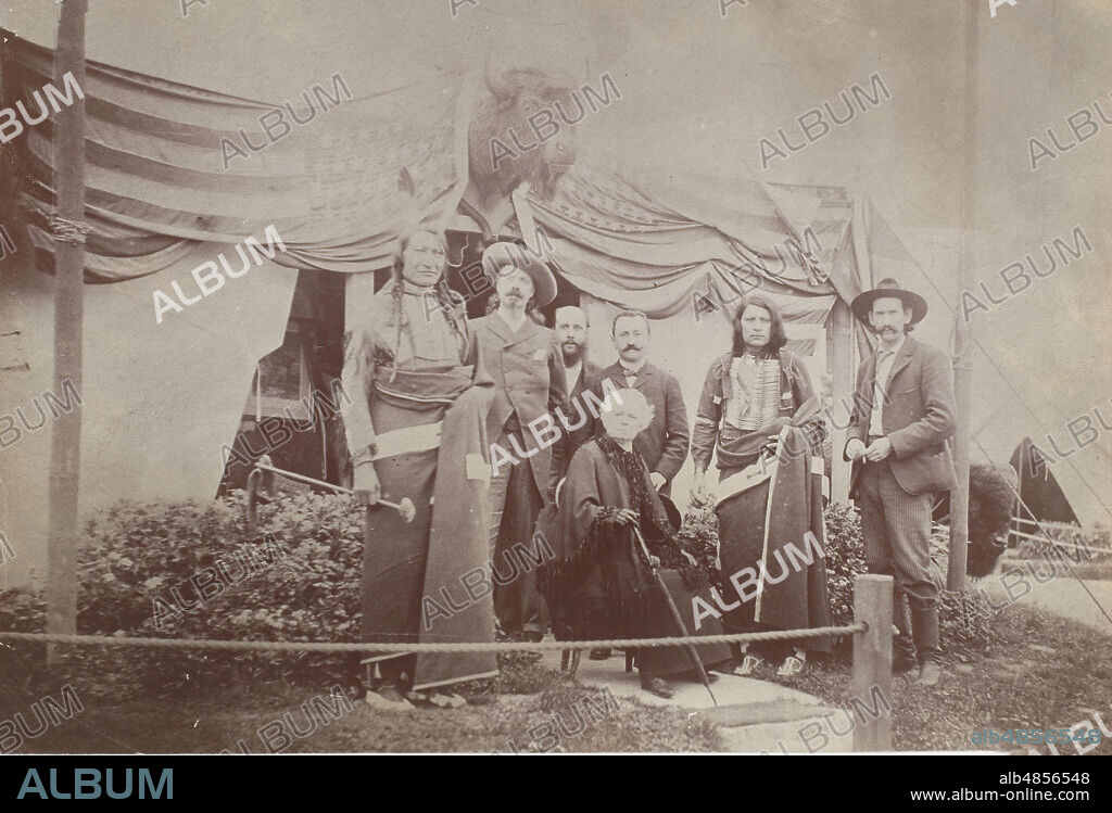 William F. "Buffalo Bill" Cody, < Name not Found! >, Chief Rocky Bear, Chief Red Shirt, William "Broncho Bill" Irving, Roland Knoedler, and [Benjamin?] Tedesco in front of Cody's Tent at the Paris Exposition Universelle, 1889.