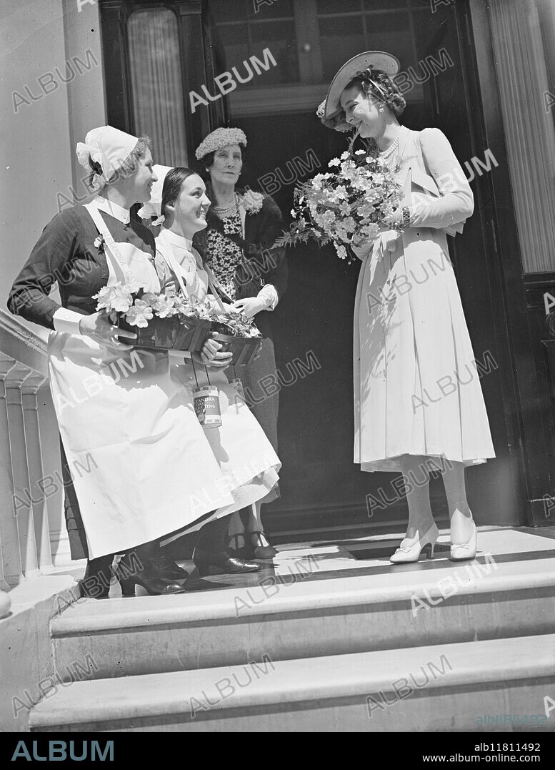 The Duchess of Kent , President of the Queen Alexandra Rose Day Fund , starts on her tour of the sellers depots. 21 June 1938.